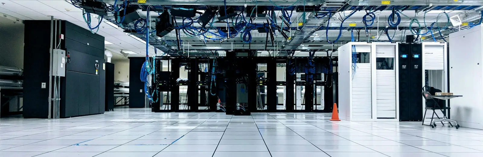 Bright, white data center with rows of server cabinets