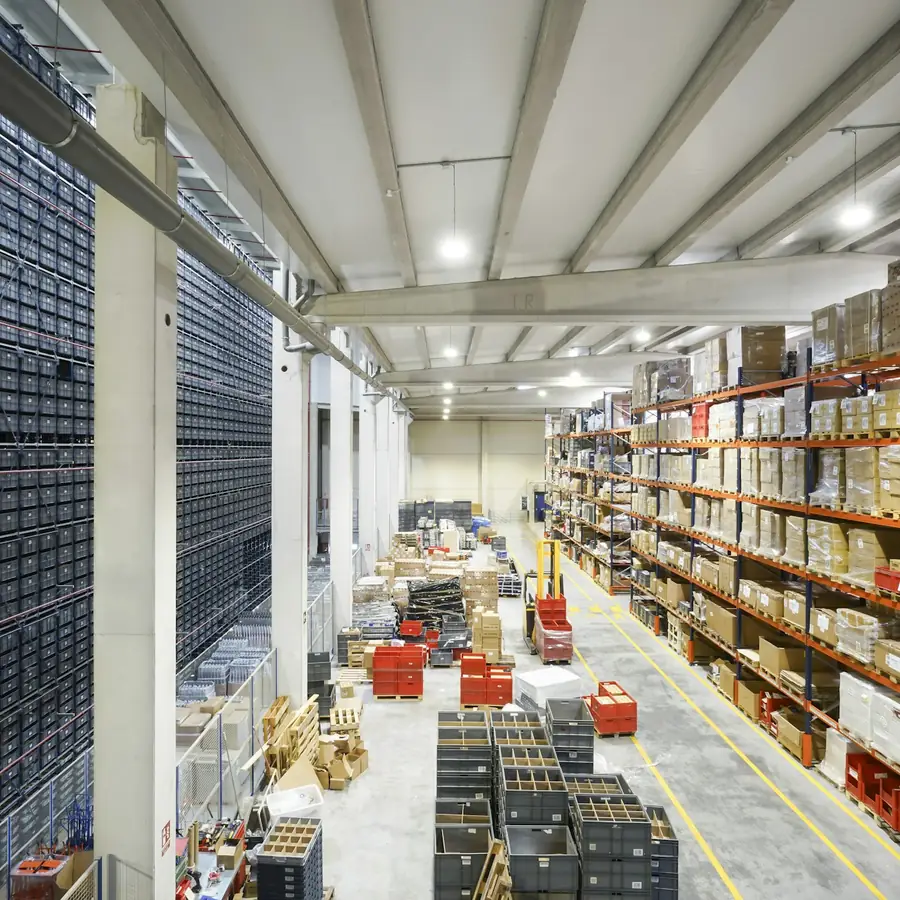 Organized warehouse shelving with labeled stock